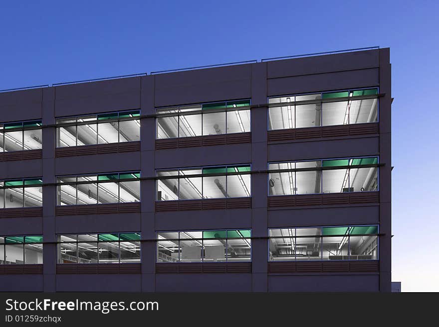 An office building with a empty parking lot