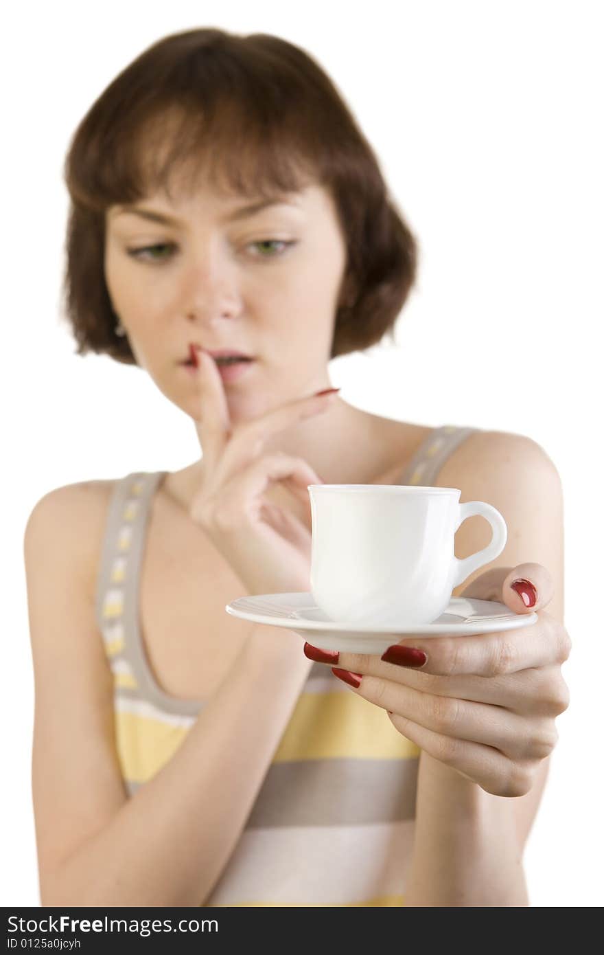 A photo of beautiful woman thinking over the first cup of tea or coffee. A photo of beautiful woman thinking over the first cup of tea or coffee