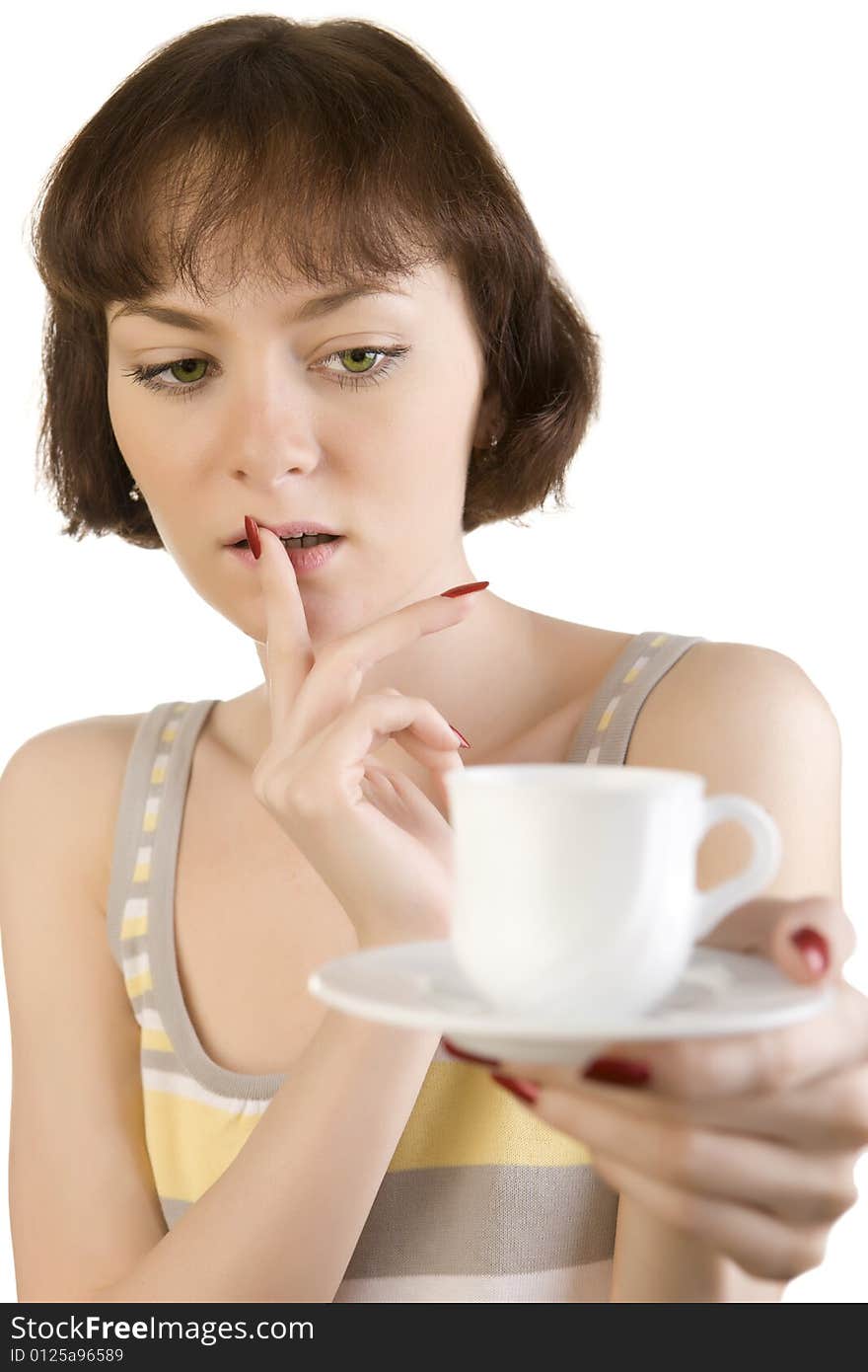 A photo of beautiful woman thinking over the first cup of tea or coffee. A photo of beautiful woman thinking over the first cup of tea or coffee