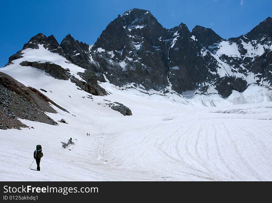 Alpinists  on glacier in Caucasus mountains. Alpinists  on glacier in Caucasus mountains