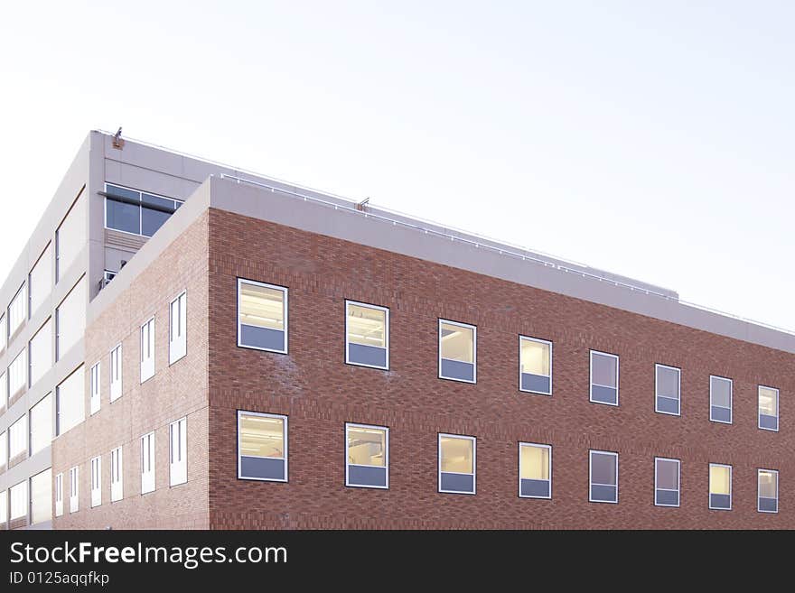 An office building with a empty parking lot