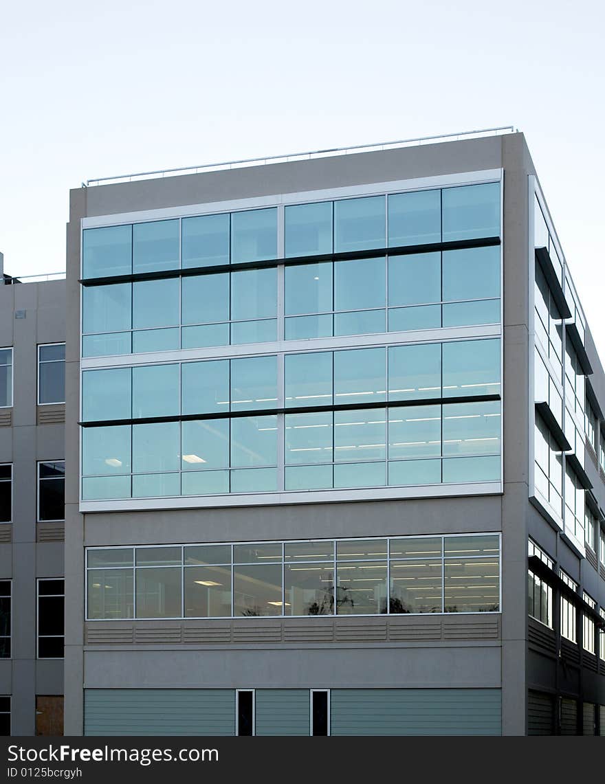 An office building with a empty parking lot