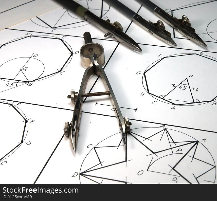 Vintage drawing tools over geometric draws