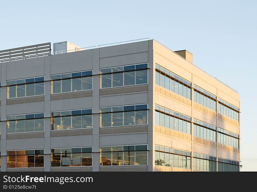 An office building with a empty parking lot