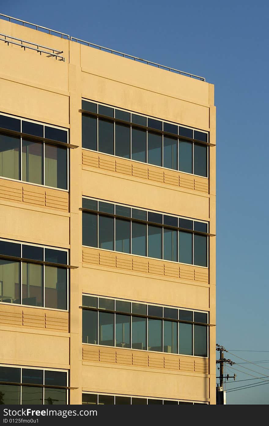 An office building with a empty parking lot