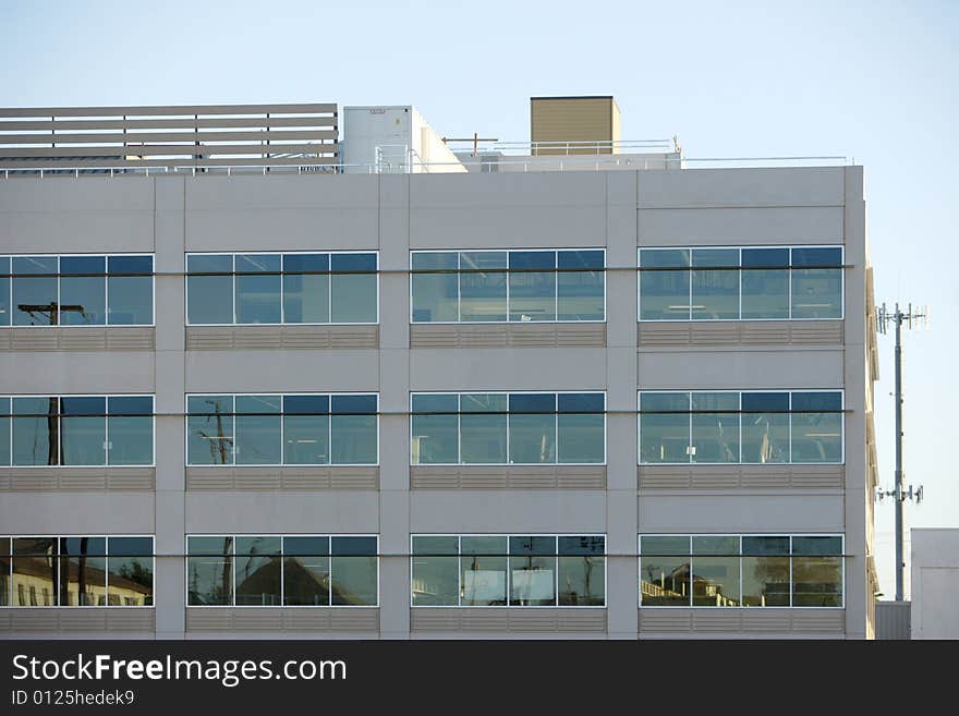 An office building with a empty parking lot