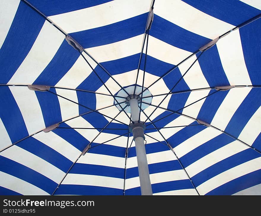 A beautiful shot of the interior of a beach umbrella. A beautiful shot of the interior of a beach umbrella