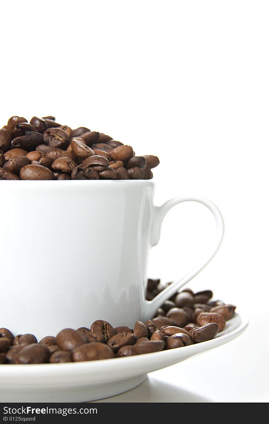 Coffee cup filled with coffee beans. Coffee cup filled with coffee beans