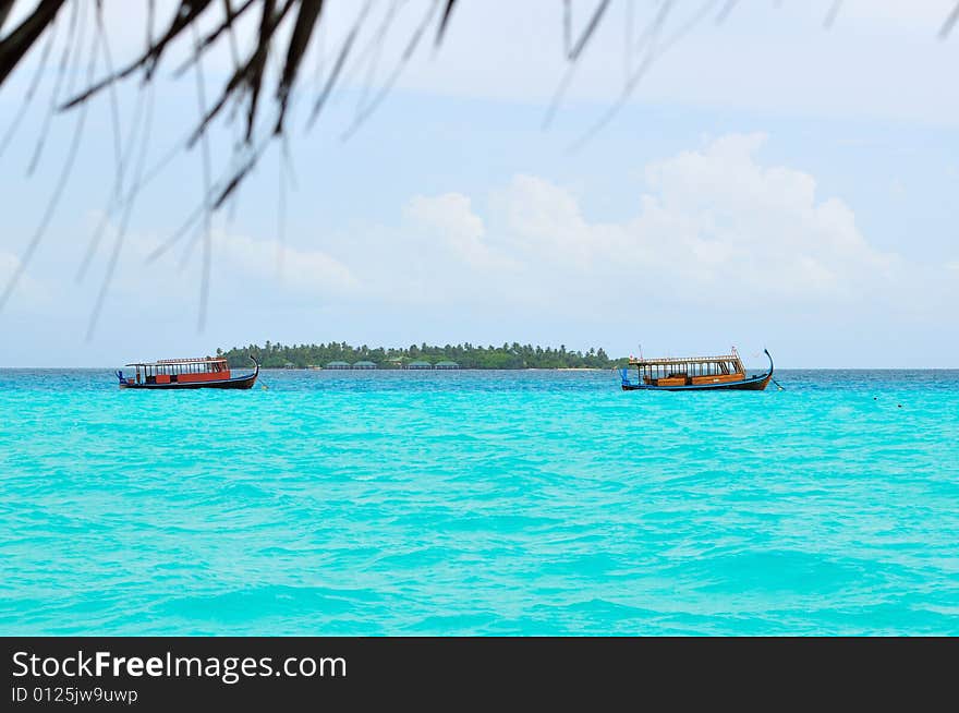 Island of Paradise. White sand beaches with coco-tree and crystal blue water. Maldives. Luxury holidays. Island of Paradise. White sand beaches with coco-tree and crystal blue water. Maldives. Luxury holidays.