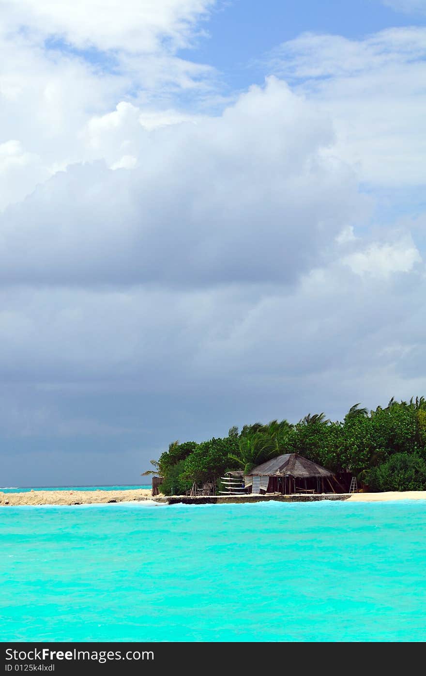 Island of Paradise. White sand beaches with coco-tree and crystal blue water. Maldives. Luxury holidays. Island of Paradise. White sand beaches with coco-tree and crystal blue water. Maldives. Luxury holidays.