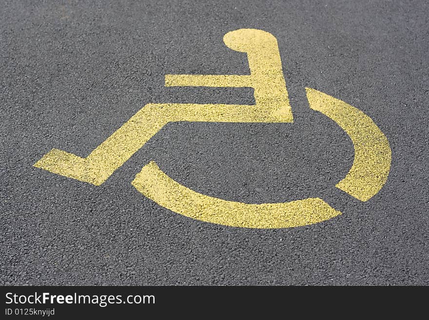 Yellow parking sign for handicapped people