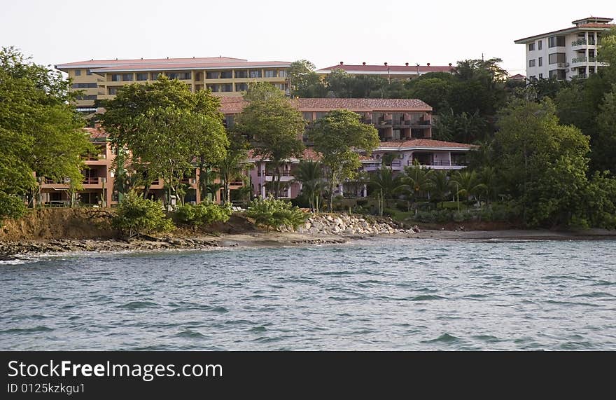 A beautiful resort of pink stucco rising out of the sea. A beautiful resort of pink stucco rising out of the sea