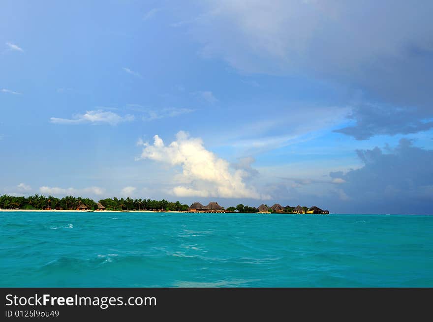 Island of Paradise. White sand beaches with coco-tree and crystal blue water. Maldives. Luxury holidays. Island of Paradise. White sand beaches with coco-tree and crystal blue water. Maldives. Luxury holidays.