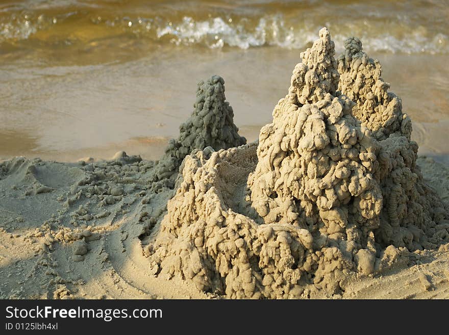 A little sandcastle on a beach