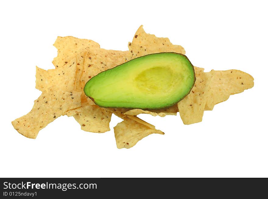 Avocado laying of taco chips, ready for a guacamole recipe. Avocado laying of taco chips, ready for a guacamole recipe