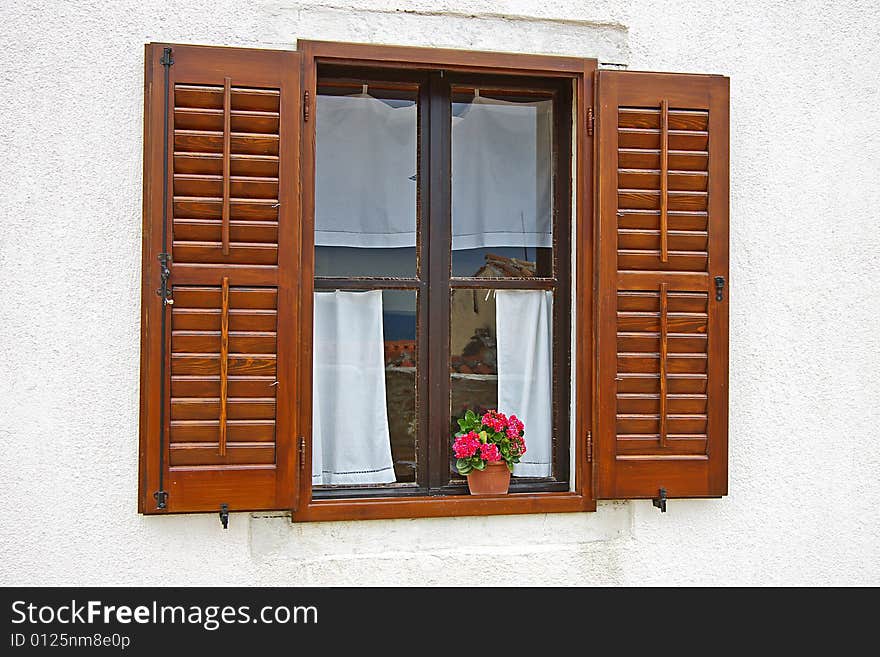 On a photo window with colors on a window sill