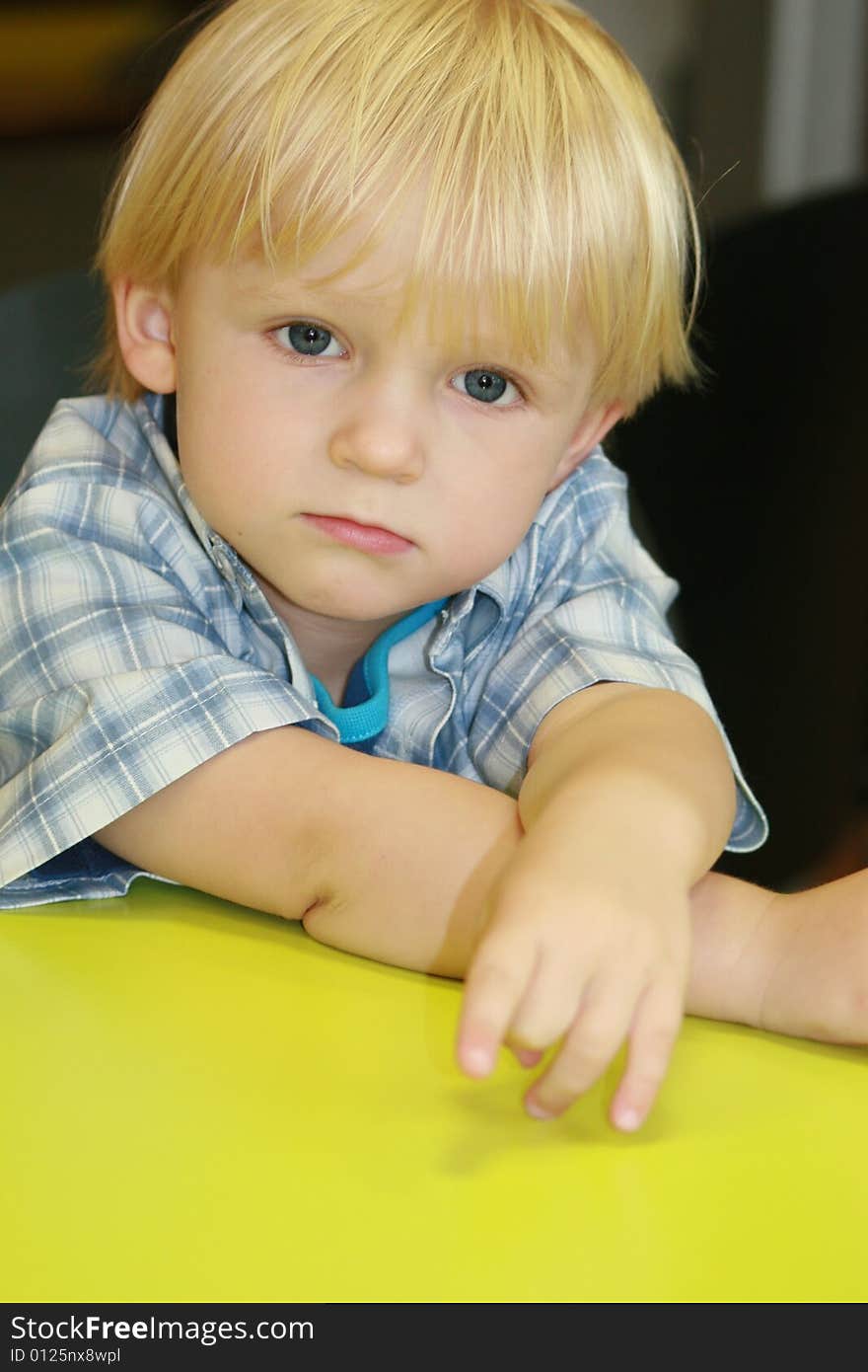 Small boy at the desk in restaurant. Small boy at the desk in restaurant