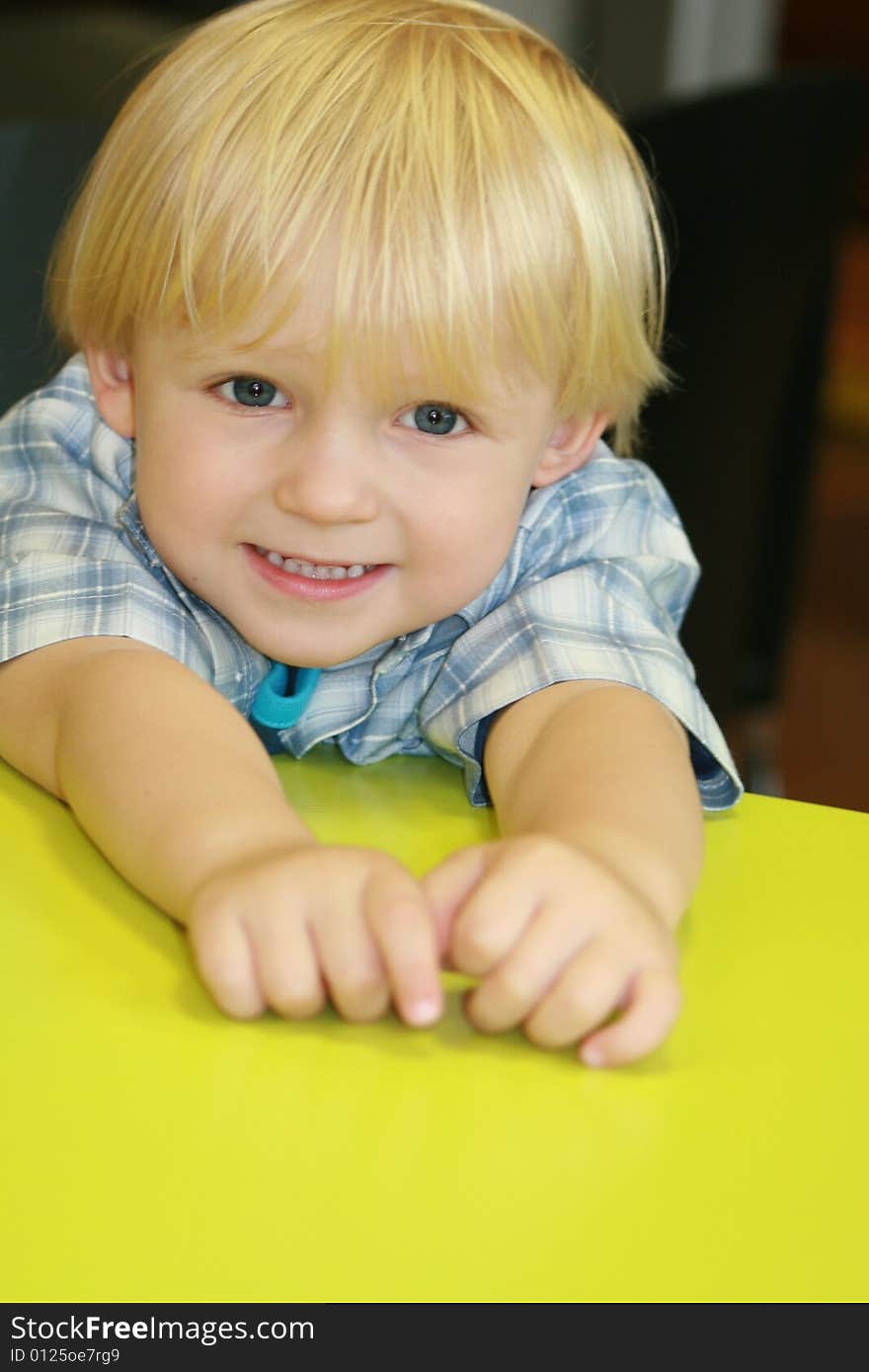 Small boy at the desk in restaurant. Small boy at the desk in restaurant