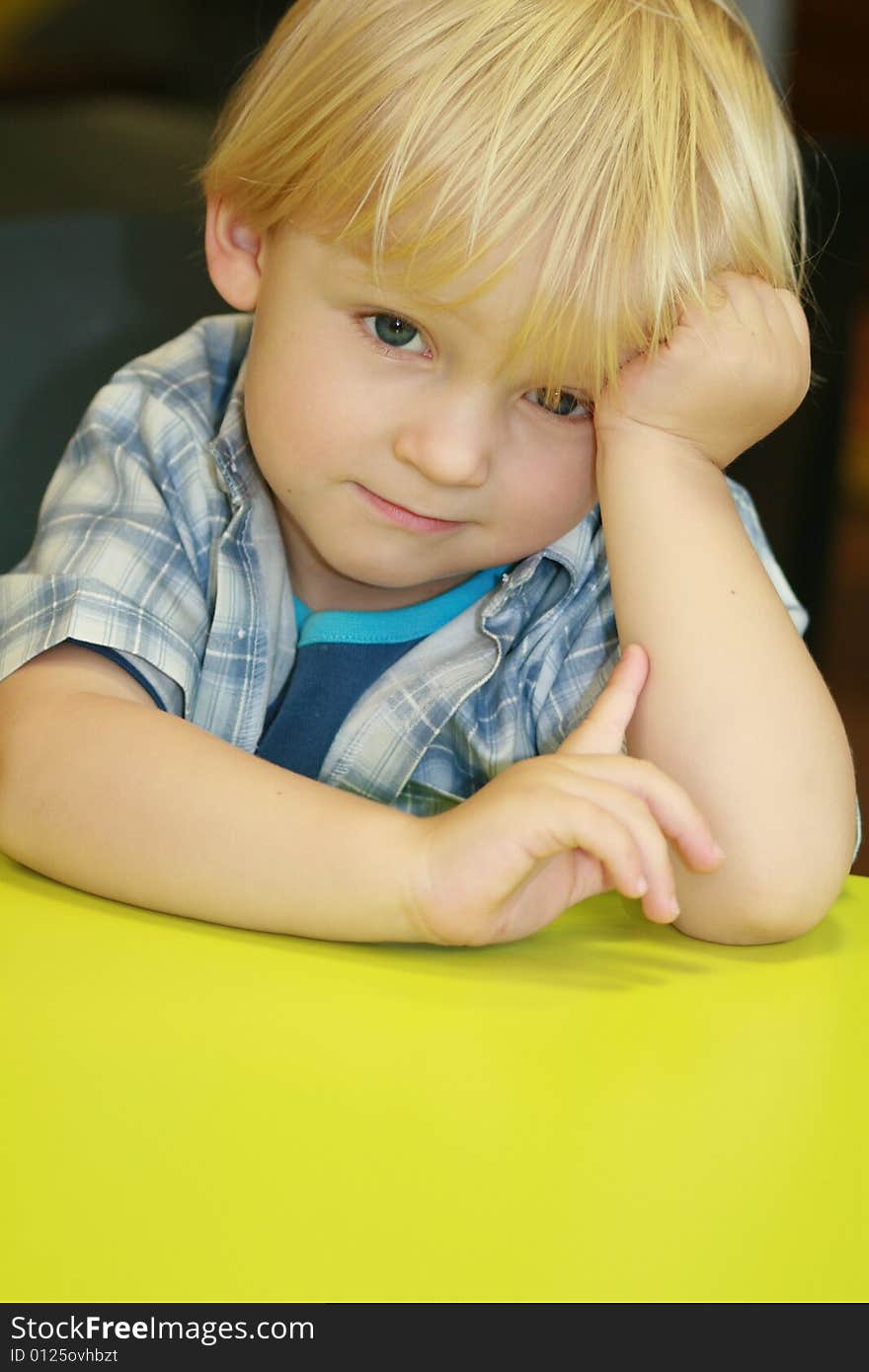 Small boy at the desk in restaurant. Small boy at the desk in restaurant