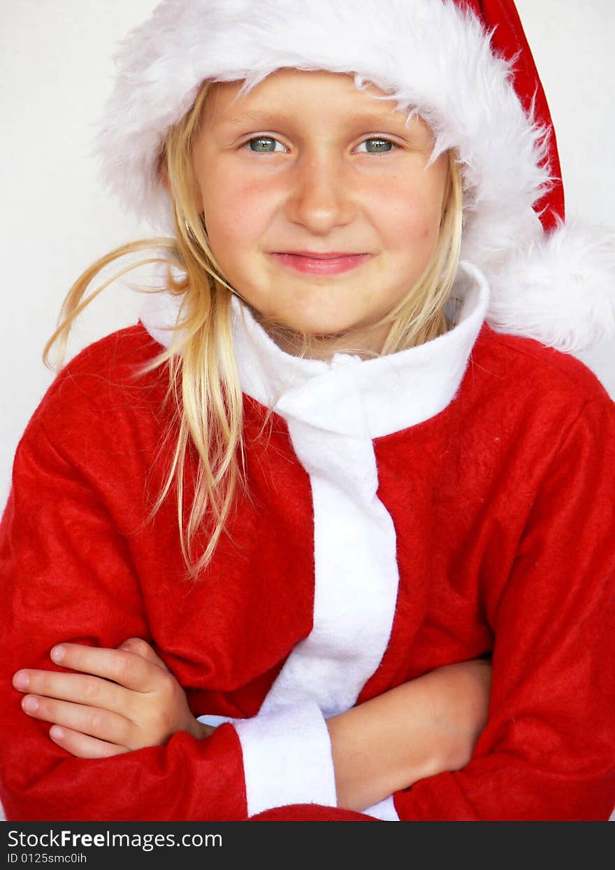 An adorable girl is  wearing a santa dress. An adorable girl is  wearing a santa dress.