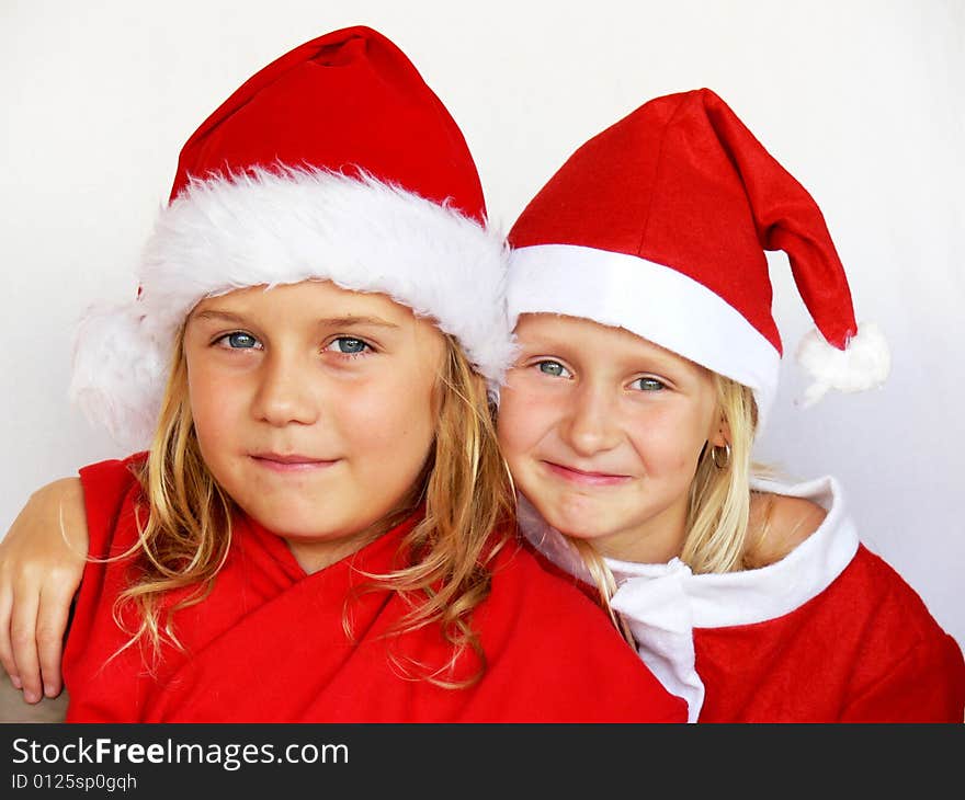 An adorable childrenl wearing a santa dress. An adorable childrenl wearing a santa dress.