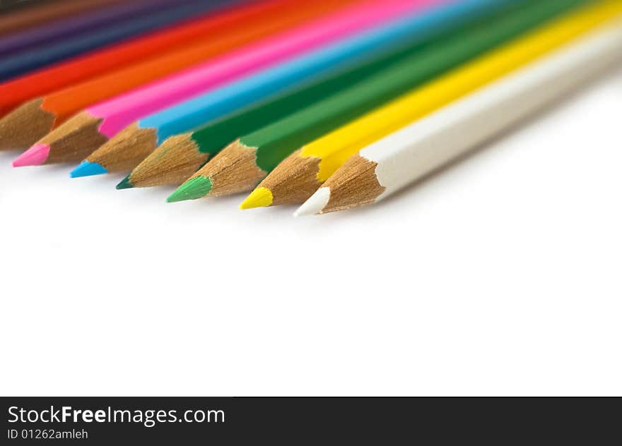 Close up colored pencils at white background