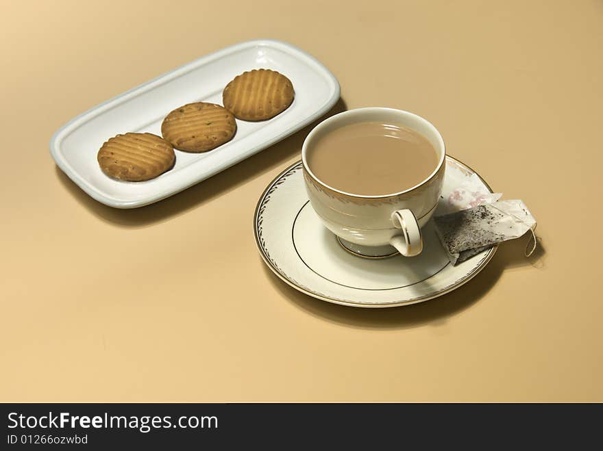 Cup of tea, tea bag and cookies. Cup of tea, tea bag and cookies