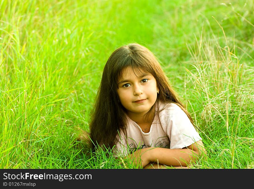 A shot of little girl on grass