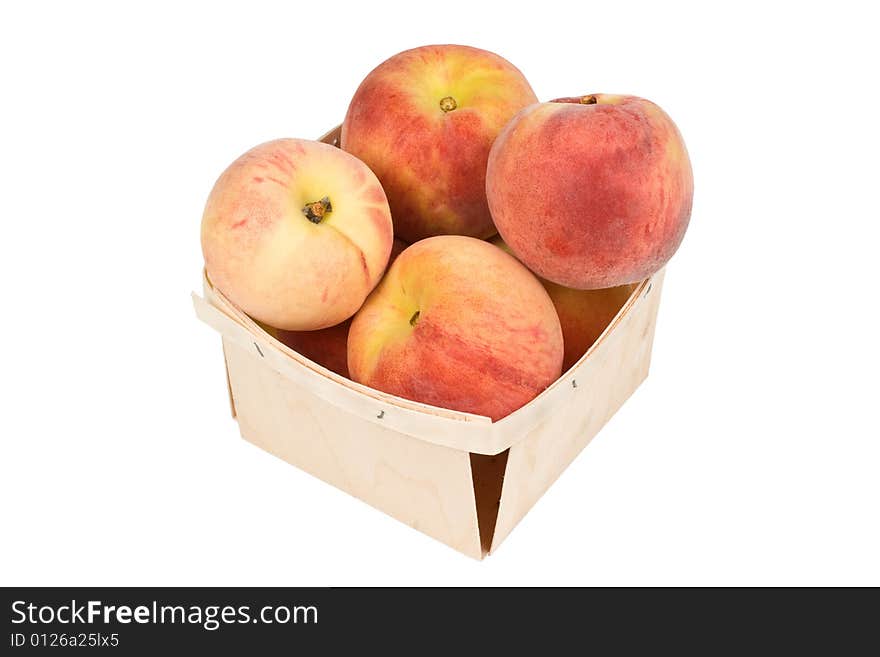 Fresh tasty peaches in a wood pint box. Fresh tasty peaches in a wood pint box