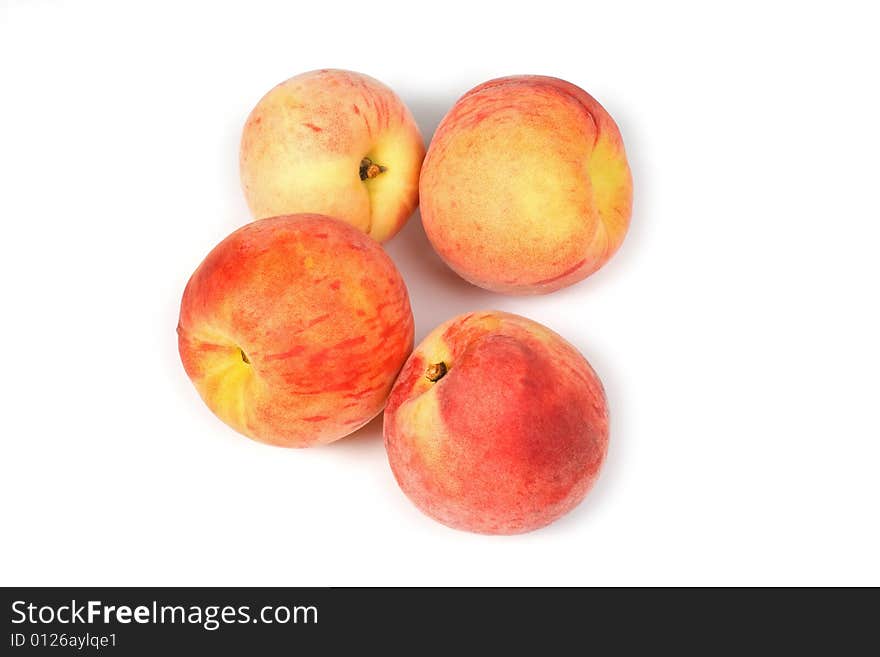 Four fresh tasty peaches on white background. Four fresh tasty peaches on white background