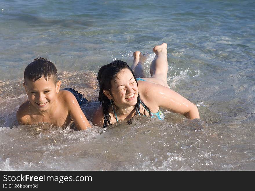 Woman And Boy On The Beach