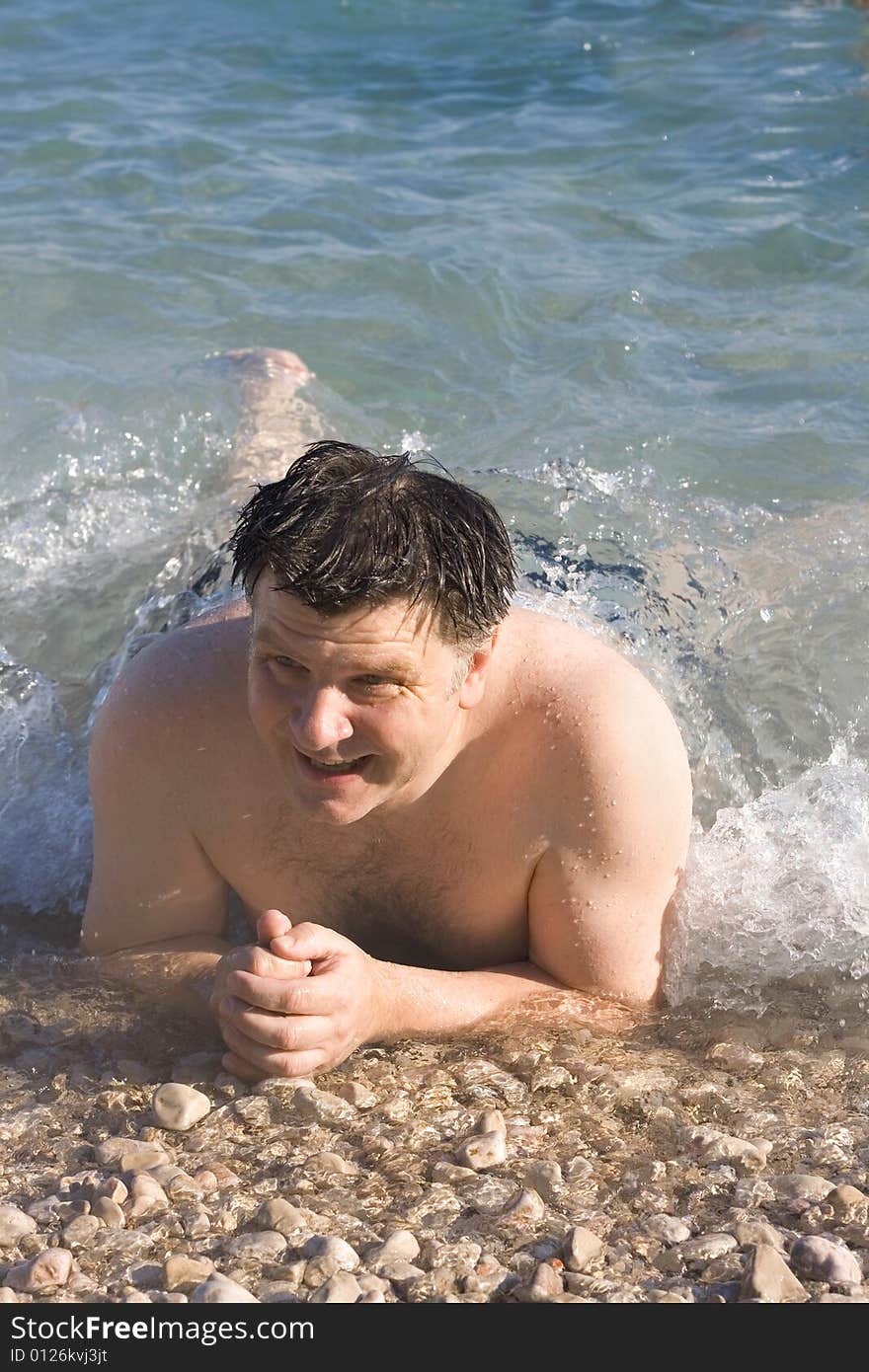 Man on the beach in summer