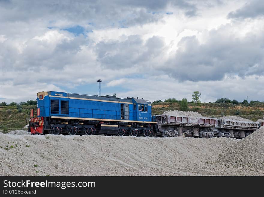 Loaded train. Industrial area. Transportation.