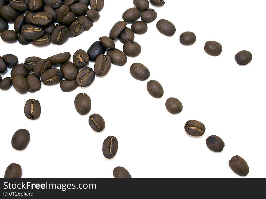 Coffee beans in sun shape on white background. Coffee beans in sun shape on white background