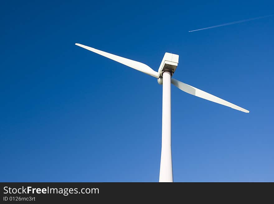 Two Bladed Windmill Against a Blue Sky