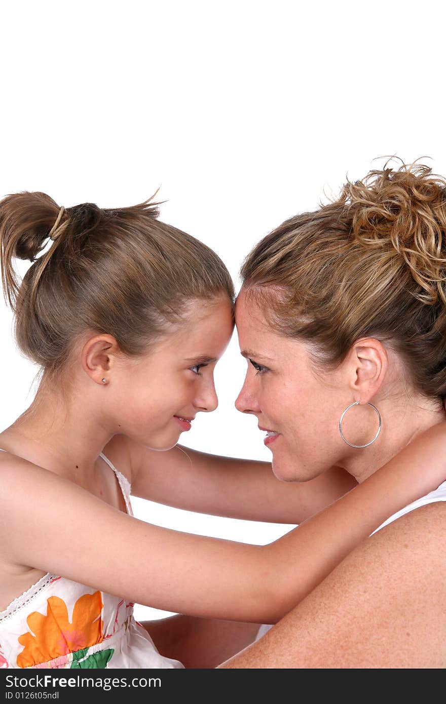 Mother and daughter with foreheads touching