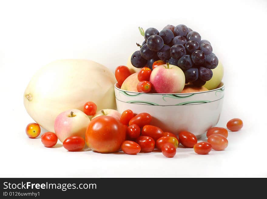 Apples,grapes, cantaloup and tomato on white background. Apples,grapes, cantaloup and tomato on white background