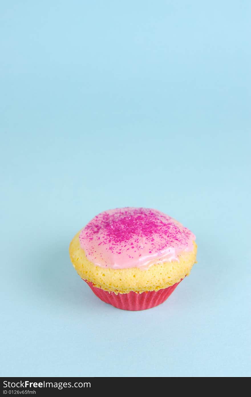 Cup cakes isolated against a blue background