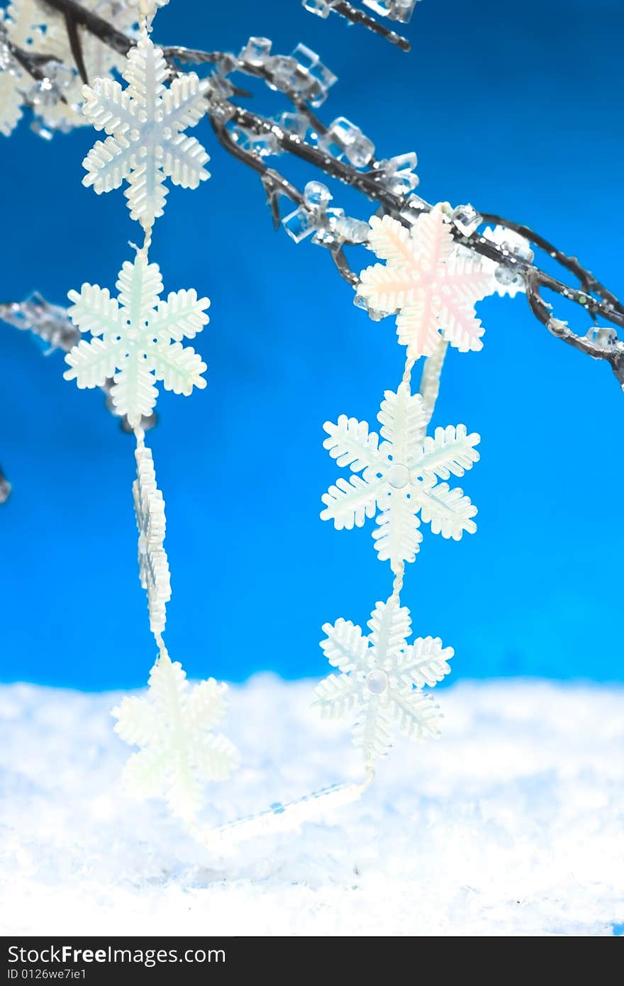 White snowflakes on Christmas tree