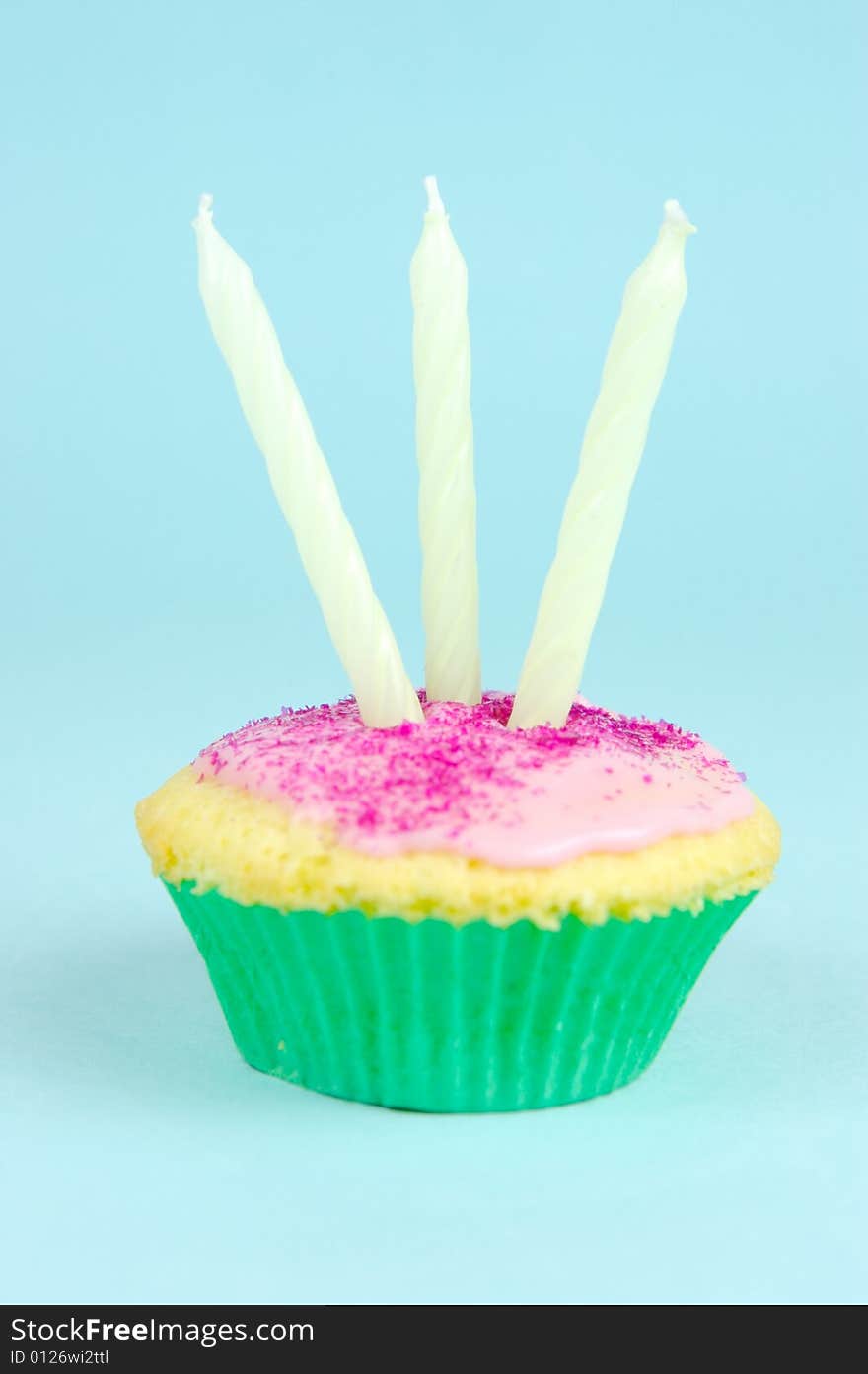 Cup cakes isolated against a blue background