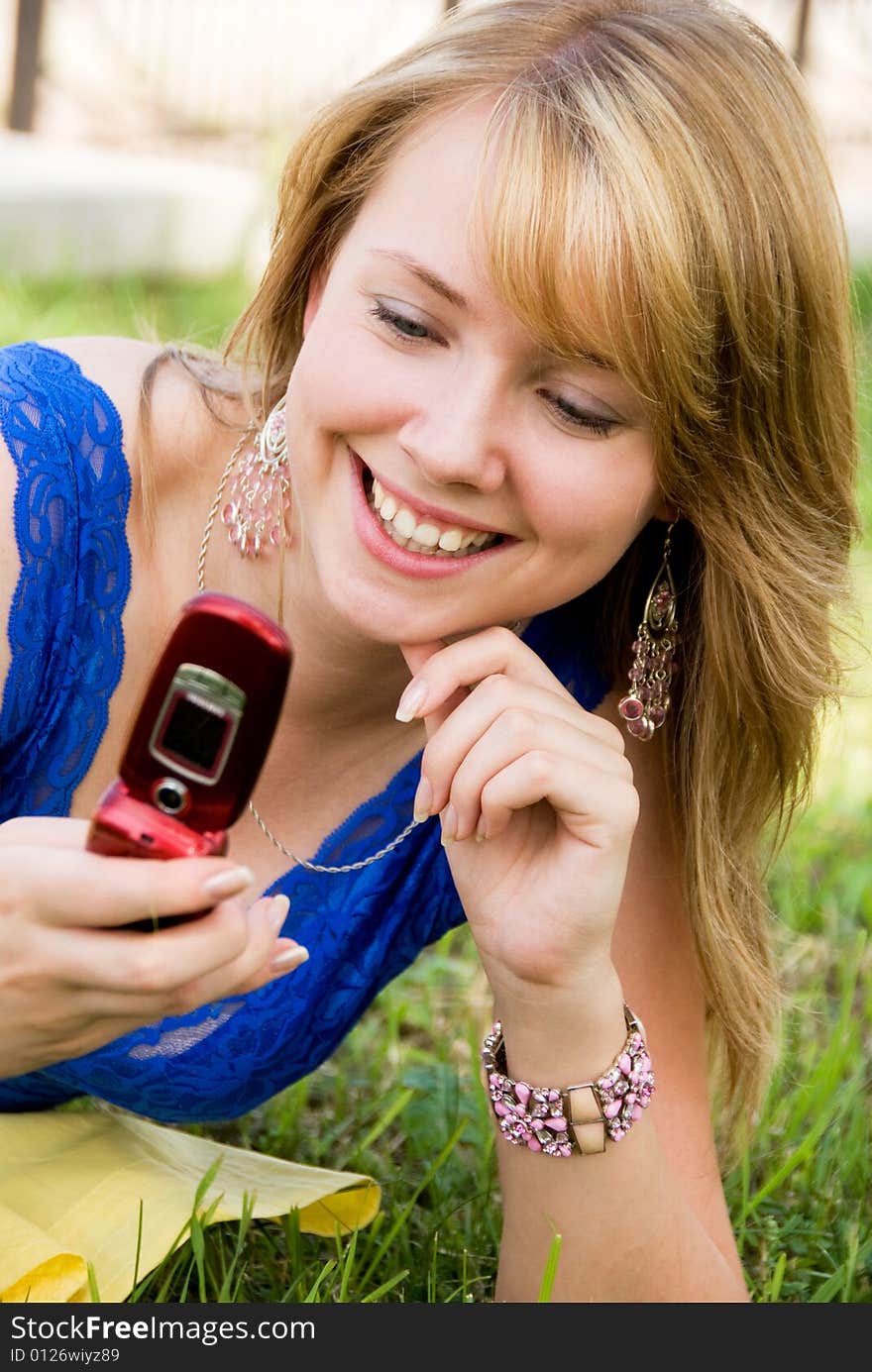 Pretty girl with a cell-phone outdoor