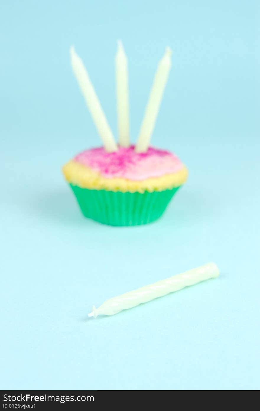 Cup cakes isolated against a blue background