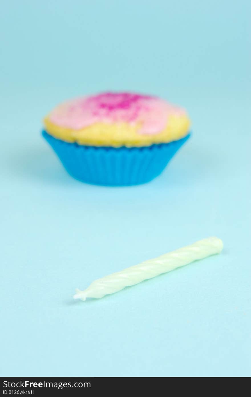 Cup cakes isolated against a blue background