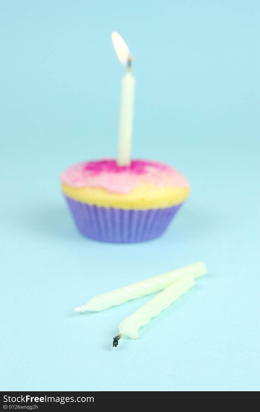 Cup cakes isolated against a blue background