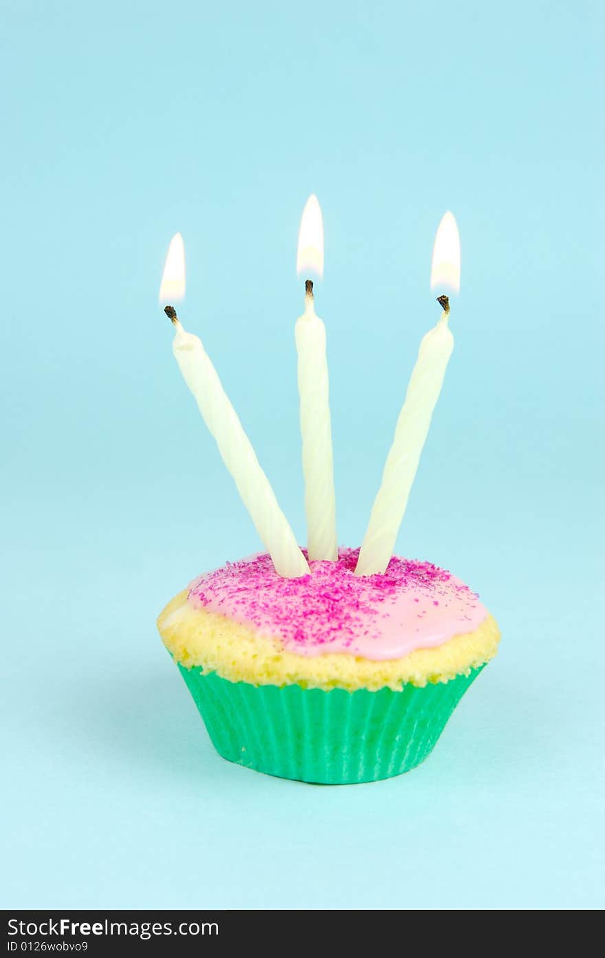 Cup cakes isolated against a blue background