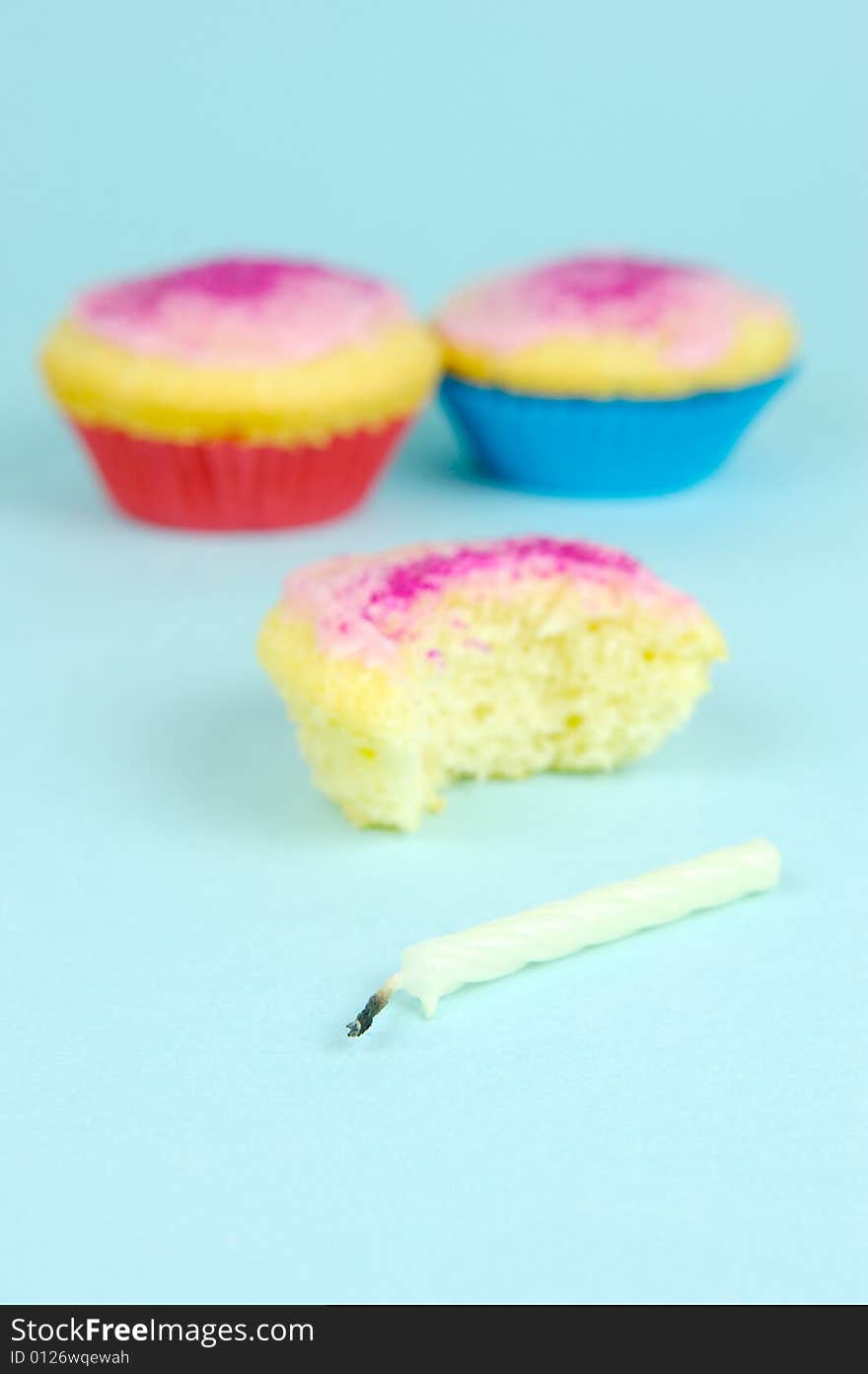 Cup cakes isolated against a blue background