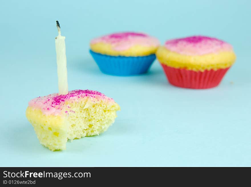 Cup cakes isolated against a blue background