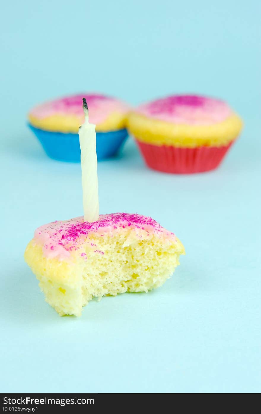 Cup cakes isolated against a blue background