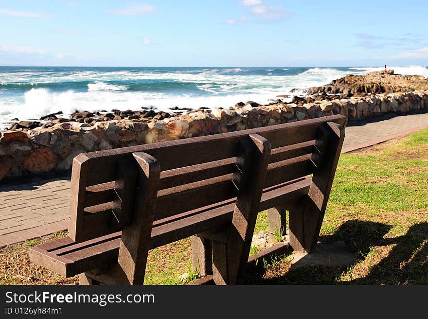 Wooden bench by the sea