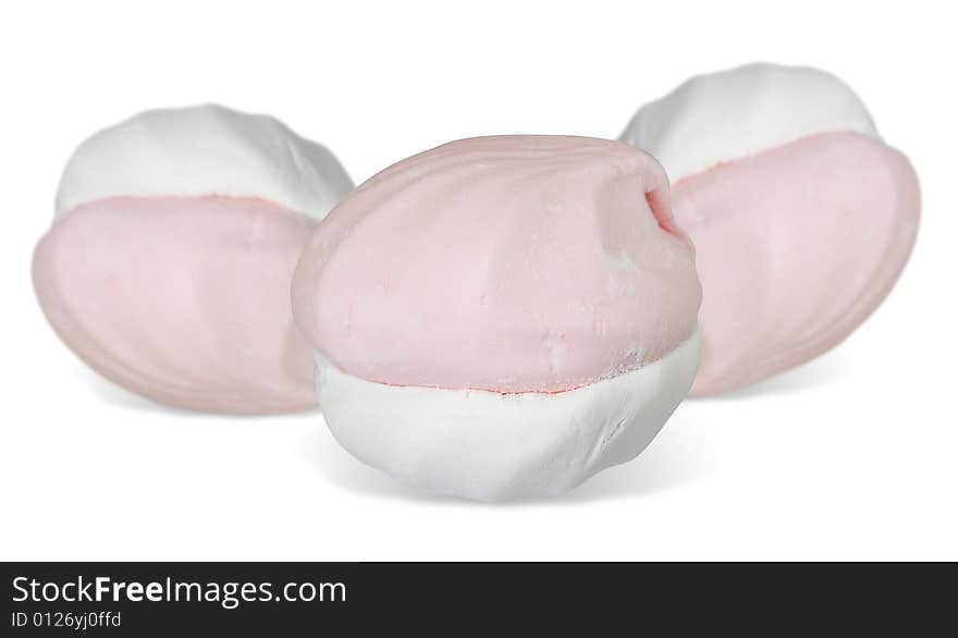 Three pink-white zephyr cakes with shadow isolated over white.